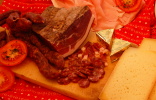 Typical South Tyrolean snack with Speck, Kaminwurzen and cheese.
