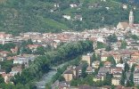 Merano with Passer river and parish church of St. Nicholas in the background.