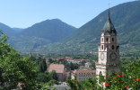 View over the spa Merano with the steeple of the parish church of Merano.